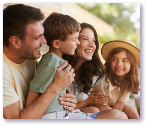 Family of four smiling